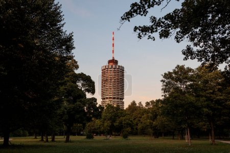 Hotel tower in Augsburg popularly called corncob in Wittelsbacher Park on a summer evening with evening glow