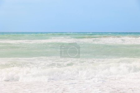 Photo for The sea in blue and green colors with crashing waves on a stormy day in Agios Georgios on the island of Corfu - Royalty Free Image