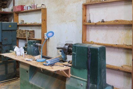 Photo for Greece, Corfu, 21.10.2023, Lathe and storage shelves in the workshop of an olive wood carver - Royalty Free Image