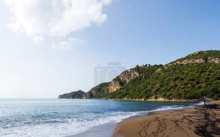 Photo for Sandy beach by the sea near Agios Georgios on the island of Corfu under a blue sky - Royalty Free Image