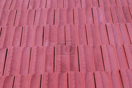Photo for Pattern of intense red roof tiles on the roof of a residential building on the Greek island of Corfu - Royalty Free Image