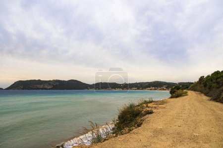 Photo for View over the sea to the mountains in the bay of Agios Georgios on the island of Corfu in the evening - Royalty Free Image