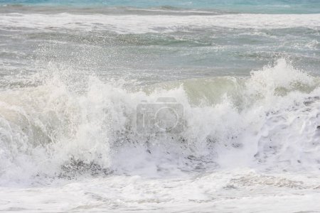 Photo for The sea in blue and green colors with crashing waves on a stormy day in Agios Georgios on the island of Corfu - Royalty Free Image