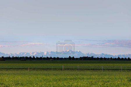 View over the fields in Inningen near Augsburg to the Alps