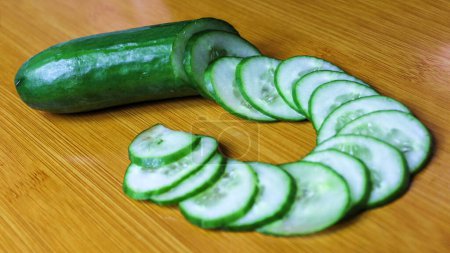 Green Cucumber is Perfectly Cut and Placed by a Chef.