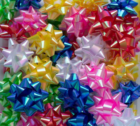 Colorful background with decorative bows for gifts.