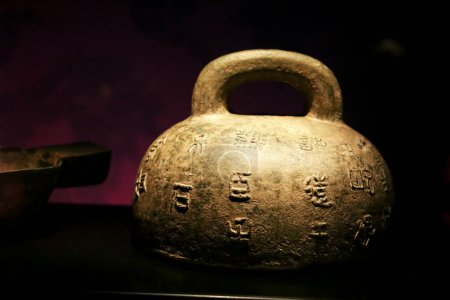 Photo for Alicante, Spain- April 14, 2023: Weight inscribed with imperial edicts at Terracota Army exhibition in the Archaeological Museum of Alicante - Royalty Free Image