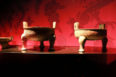 Photo for Alicante, Spain- April 14, 2023: Ding cooking vessels with pigments at Terracota Army exhibition in the Archaeological Museum of Alicante - Royalty Free Image