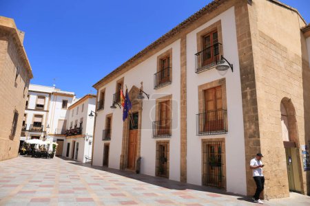 Photo for Javea, Alicante, Spain- May 16, 2023: Town hall facade in the old town of Javea under blue sky - Royalty Free Image