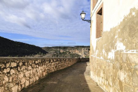 Photo for Narrow street and vintage streetlight in Priego town, Cuenca region, Spain - Royalty Free Image