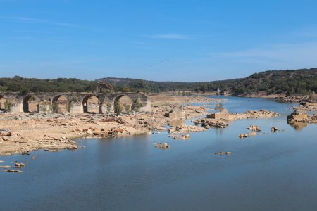 Remains of the Historical Ajuda bridge over the Guadiana River, located between the border of Spain and Portugal