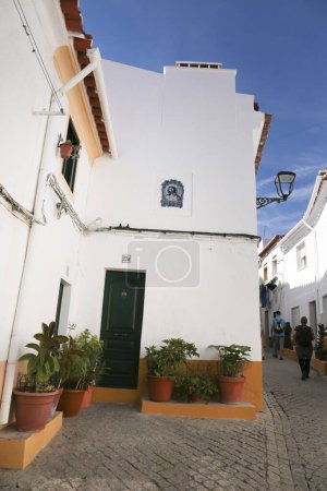 Narrow street with typical Portuguese houses in Elvas, Portugal