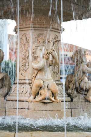 Baroque marble fountain in the main square of Merida, called Plaza de Espana
