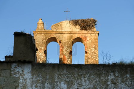 Stone nest on remains of antique church in the old town of Merida