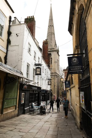 Photo for Bristol, England- March 30, 2024: Narrow street next to St. Nicholas Market in Bristol city full of restaurants, pubs and shops - Royalty Free Image