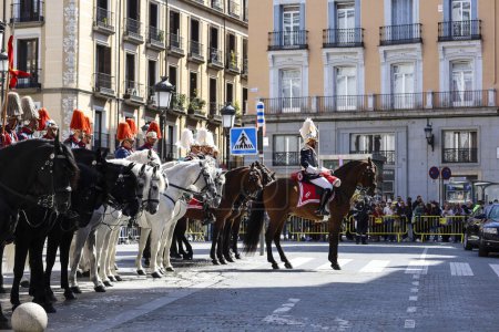 Photo for Madrid, Spain- April 8, 2024: Cuirassiers of the Royal Guard in traditional uniform through the streets of Madrid city, Spain - Royalty Free Image