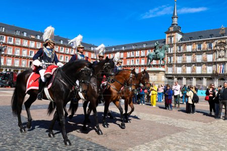 Photo for Madrid, Spain- April 8, 2024: Cuirassiers of the Royal Guard in traditional uniform in Plaza Mayor Square in Madrid - Royalty Free Image