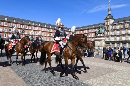Photo for Madrid, Spain- April 8, 2024: Cuirassiers of the Royal Guard in traditional uniform in Plaza Mayor Square in Madrid - Royalty Free Image