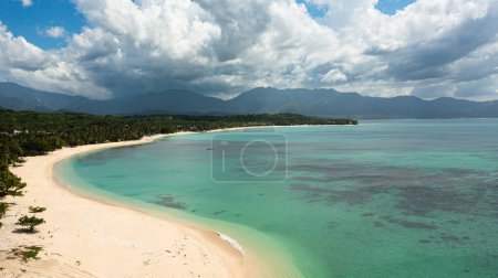 Photo for Tropical beach with palm trees. Tropical beach scenery. Pagudpud, Ilocos Norte Philippines - Royalty Free Image