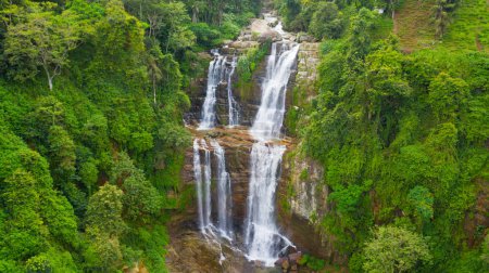 Photo for Waterfall in a tropical forest. Aerial view of Lower Ramboda Falls. Sri Lanka. - Royalty Free Image