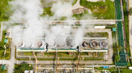 Aerial view of geothermal power plant in a mountainous province. Renewable energy production at a power station. Negros, Philippines.