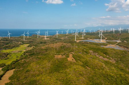 Photo for Wind turbines producing clean sustainable energy, clean energy future. Wind power plant. Philippines. - Royalty Free Image