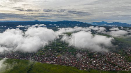 Photo for Aerial view of valley with tea plantations and farmland with clouds. Kayu Aro, Sumatra, Indonesia. Tea estate landscape. - Royalty Free Image