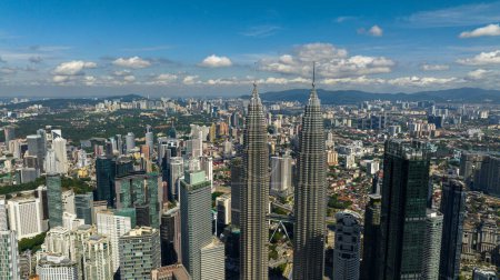 Photo for Kuala Lumpur, Malaysia - September 11, 2022: Aerial drone of Kuala Lumpur, capital of Malaysia. Petronas twin towers. - Royalty Free Image