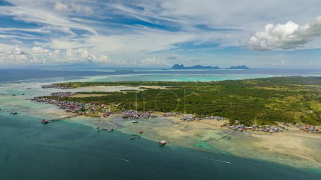 Aerial drone of island Bum Bum with towns and villages. Semporna, Sabah, Malaysia.
