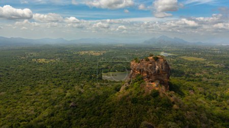 Aerial drone of the Sigiriya rock among the green jungle on the island of Sri Lanka.