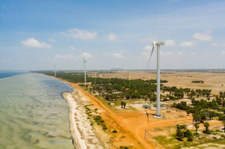 Aerial drone of Wind turbines producing clean sustainable energy, clean energy future. Wind power plant. Jaffna, Sri Lanka.