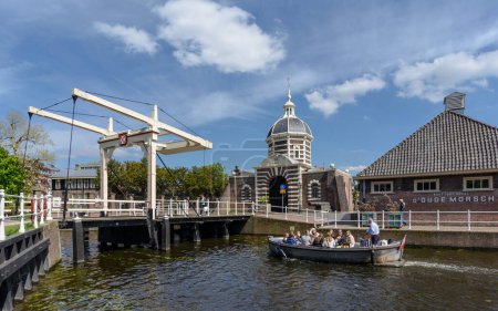 Photo for Leiden, Netherlands - May 2, 2018: A group of women sails through Leiden in a boat - Royalty Free Image