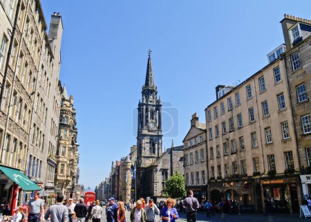 Photo for Edinburgh -Scotland - june 25 2009; Prominent Tron Church clock tower and spire in Royal Mile crowded with tourists - Royalty Free Image