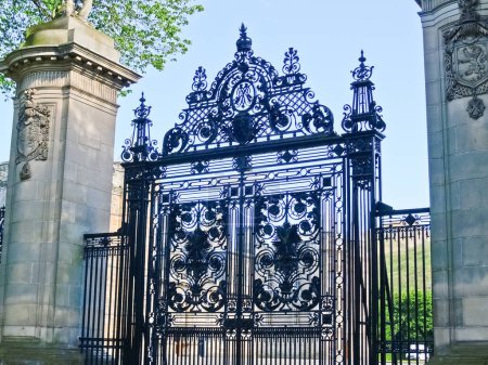 Photo for Edinburgh Scotland, june 25 2009; Ornate wrought iron gate at entrance to Holyrood Palace, the residence of the Queen when in visiting Scotland. - Royalty Free Image