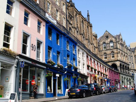 Photo for Edinburgh Scotland, june 25 2009; Downtown Edinburgh shops and apartments in colourful street. - Royalty Free Image