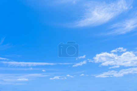 Blue sky with white clouds of different formations.