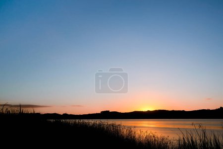 Photo for Sunrise over calm Wairoa river at Dargaville New Zealand. - Royalty Free Image