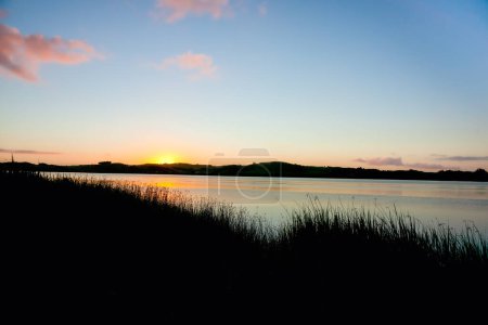 Photo for Sunrise over calm Wairoa river at Dargaville New Zealand. - Royalty Free Image