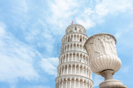 Photo for Pisa Italy - April 23 2011; Ornamental urn near base of famous Leaning Tower of Pisa - Royalty Free Image