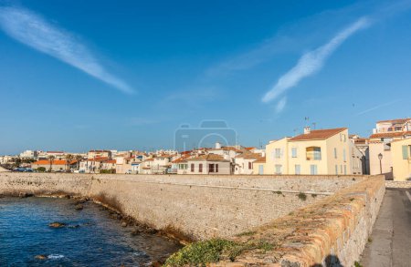 Photo for Large coastal defense seawall and urban residences at Antibes in Southern France. - Royalty Free Image