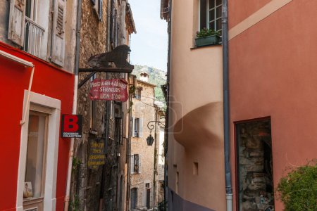 Photo for Saint Paul de Vence, Provence,  France May 2 2011; Typical narrow shady urban European lane with hotel accommodation sign. - Royalty Free Image