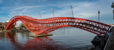Photo for Red Python Bridge in Amsterdam, connecting Sporenburg and Borneo Island in Eastern Docklands - Royalty Free Image