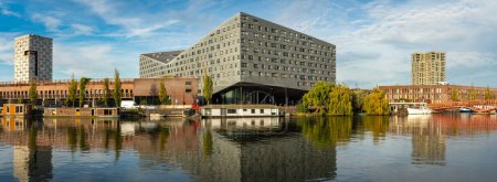 Photo for Amsterdam, The Netherlands, 27.10.2022, Panorama of Eastern Docklands, view of the iconic modern building known as The Whale at Sporenburg - Royalty Free Image