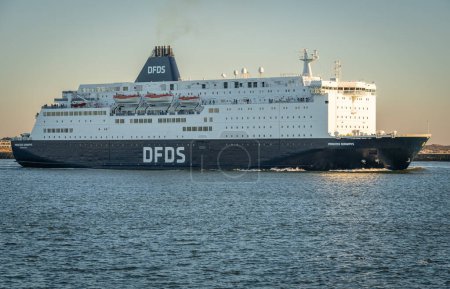 Photo for Ijmuiden, The Netherlands, 28.02.2023, Ferry to Newcastle of Danish international shipping and logistics company DFDS leaving the habrour of Ijmuiden - Royalty Free Image