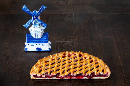 Limburg cherry vlaai, traditional dutch pastry displayed on wooden table