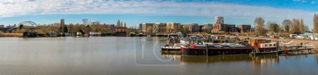 Photo for Panorama of Amsterdam-Oost, harbor at Zuider IJdijk and modern architecture of Cruquiuseiland suburb - Royalty Free Image