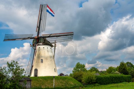 Historical white windmill De Volharding from 1891 in the village of Zeddam, Province Gelderland, The Netherlands