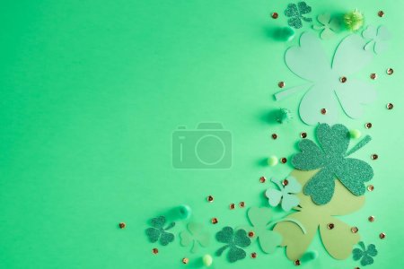 St. Patricks Day themed green background with shamrock clover of various sizes and shades of green.
