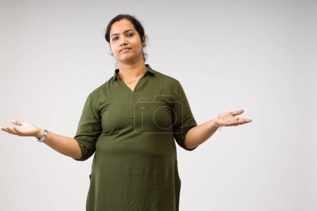 Photo for Portrait of an Indian woman,Standing pose showing different gesters, with white background ,isolated. - Royalty Free Image