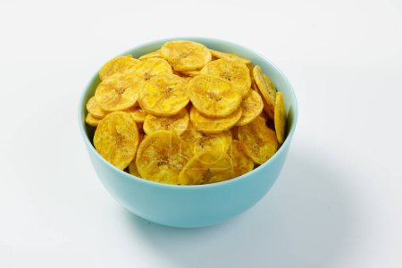 Photo for Kerala chips or Banana chips, cult snack item of Kerala,arranged in a pastle colour ceramic bowl,Isolated image with white background - Royalty Free Image